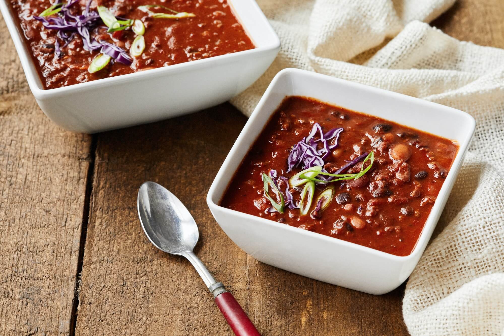 Bowls of Chili Soup with a spoon