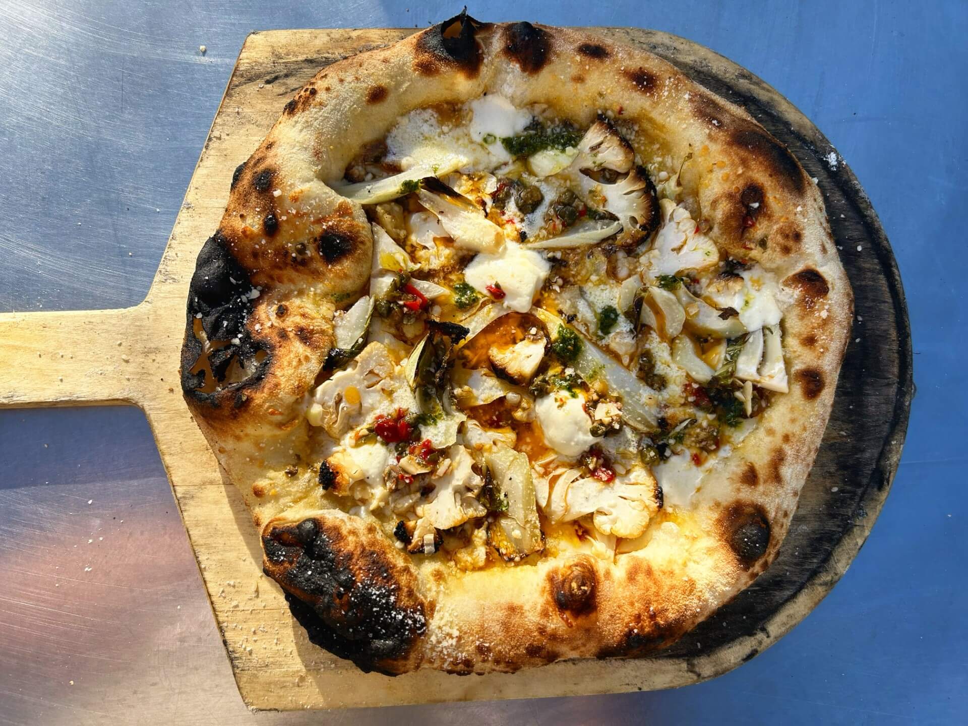 open fire pizza on wood board